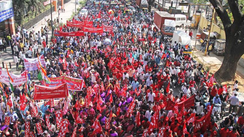 Members of All-India Trade Union Congress take out a march on the first day of the two-day nation-wide bandh against the central government policies, in Bengaluru on Tuesday	 DC