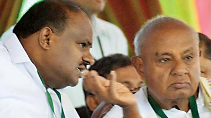 Chief Minister, H D Kumaraswamy and party patriarch, H D Deve Gowda