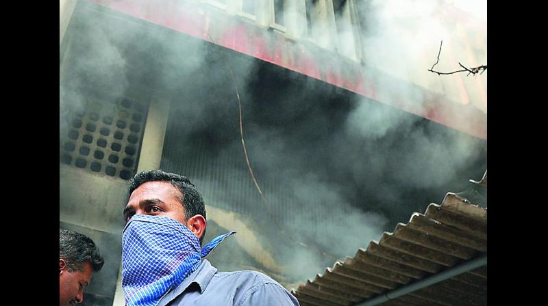 Smoke rises from the Rail Nilayam building on Saturday in Secunderabad. (Photo: DC)