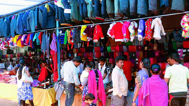 Citizens buying winter wear at the Tibetan sweater market opposite Ashoka Theatre in Warangal on Saturday. (Photo: DC)