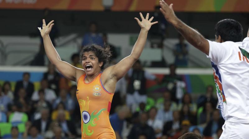 Fighting back from 0-5 down to beat Aisuluu Tynybekova of Kyrgyzstan 8-5 in the dying minutes of the bronze medal play-off match in womens 58kg freestyle, Sakshi Malik ended Indias painful wait at the 2016 Rio Olympics for a medal. (Photo: AP)