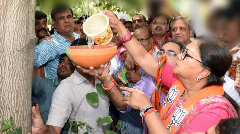CM Raje also launched a drinking water kiosk that carries a BJP banner with a picture of its election symbol. (Photo: @VasundharaBJP/Twitter)