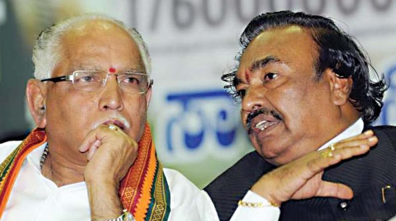 A file photo of state BJP chief B.S. Yeddyurappa in conversation with party leader K.S. Eshwarappa