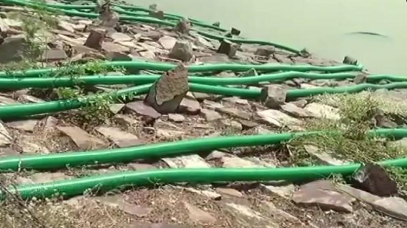 Ever since the body surfaced, no one turned up to fetch water. The villagers unanimously decided to empty the lake. (Photo: ANI)