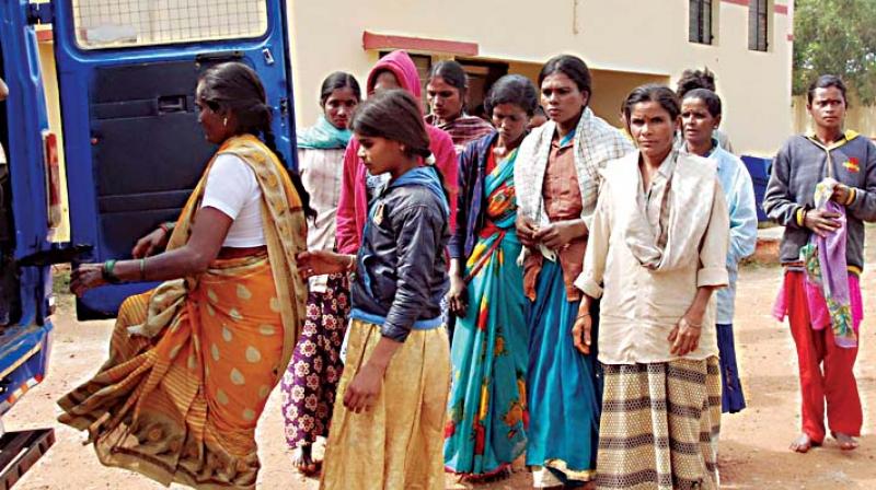 Rescued bonded labourers in Hassan on Monday  (Photo:DC)