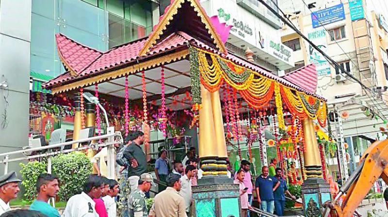 GHMC enforcement teams removing footpath encroachments on Monday. 	(Photo:DC)