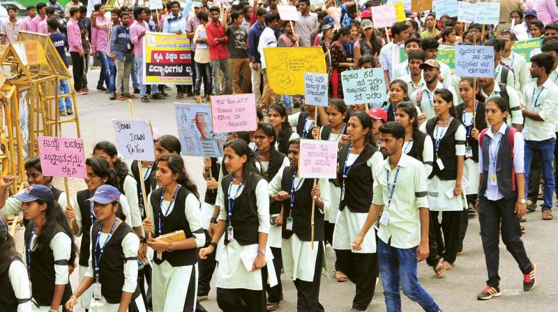 Students from University of Agricultural Sciences (UAS) in a rally to protest against privatisation of state agricultural courses, in Bengaluru on Monday.