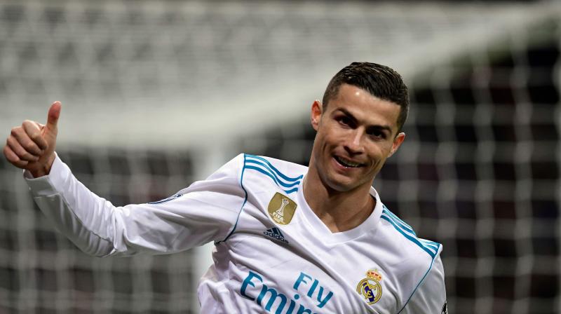 Cristiano Ronaldo became the first player to score in all six Champions League group-stage matches in a season while also equalling his Barcelona rival Lionel Messis record of 60 group-stage goals in total. (Photo: AFP)