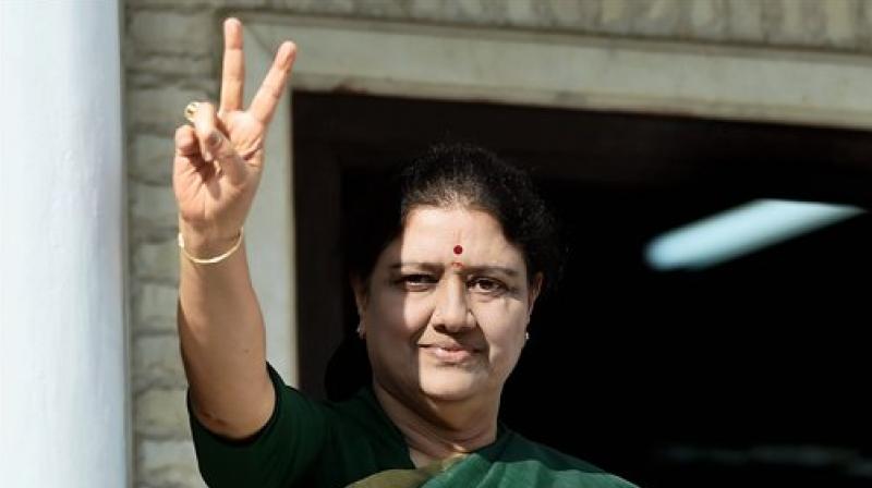 AIADMK General Secretary V K Sasikala flashes a victory sign after attending the party MLAs meeting in which she was elected as a AIADMK Legislative party leader, set to become Tamil Nadu CM, at Partys Headquarters in Chennai. (Photo: PTI)