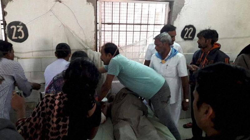 Volunteers provide treatment to injured after Hirakhand Express had an accident near Kuneru station in Vizianagaram, Andra Pradesh on late Saturday night. (Photo: PTI)