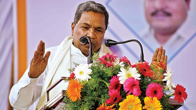 So my government will write to the EC to do away with them for the 2018 poll, \ Mr Siddaramaiah. (Photo: DC)