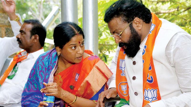 The BJPs Ballari Lok Sabha candidate Joladarashi Shanta and her brother and former Ballari MP B. Sriramulu at the filing of her nomination in Ballari on Tuesday