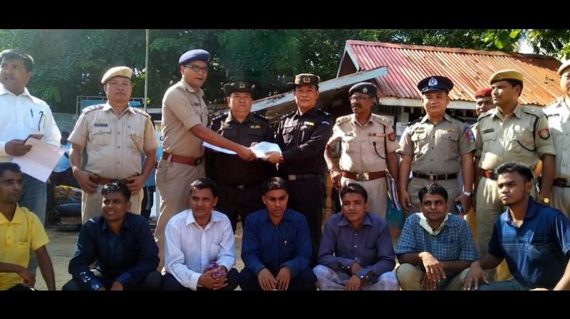 Assam Police hands over the 7 Rohingyas to Myanmar authorities after deportation formalities were completed. (Photo: Twitter | ANI)