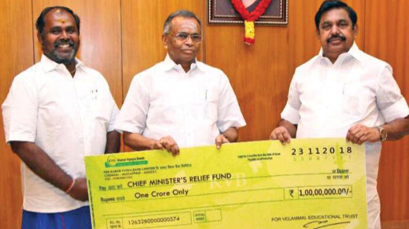 Mr. M.V. Muthuramalingam, Chairman, Velammal Educational Trust, presented a cheque for 1 Crore towards the CMs Public Relief Fund to Chief Minister of Tamil Nadu, Edappadi K. Palaniswami. (Photo: DC)