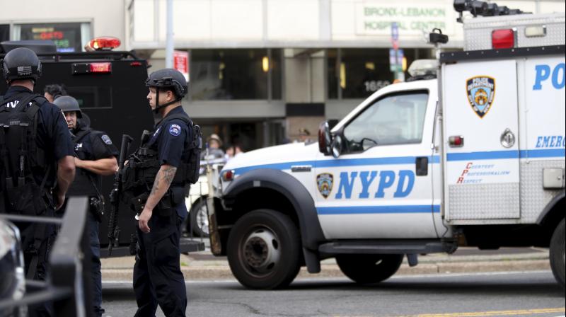 Police gather outside Bronx Lebanon Hospital in New York after a gunman opened fire and then took his own life there on Friday. (Photo: AP)