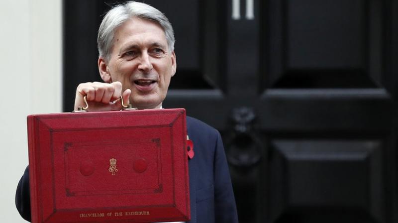 Britains Chancellor of the Exchequer Philip Hammond holds up the traditional red dispatch box.