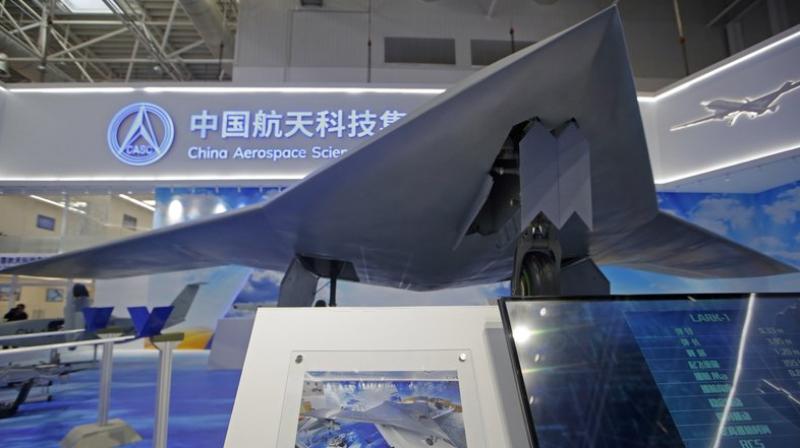 The CH-7â€²s chief designer Shi Wen says the aircraft can  fly long hours, scout and strike the target when necessary.  (AP Photo/Kin Cheung)