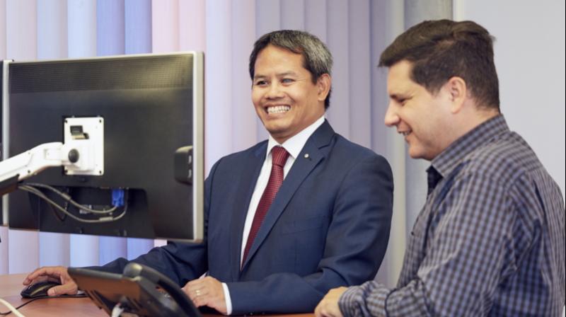 Kannarath Meystre and Luciano Butera demonstrate the use of screen readers, which greatly improved access to technology for those with visual impairments.