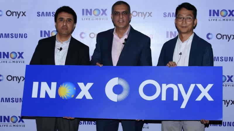 Seen from Right to left Mr. Puneet Sethi, Vice President, Consumer Electronics Enterprise Business, Samsung India, Mr. Alok Tandon, Chief Executive Officer, INOX Leisure Limited. and Mr. SH Jang, Director Consumer Electronics Enterprise Business, Samsung India.