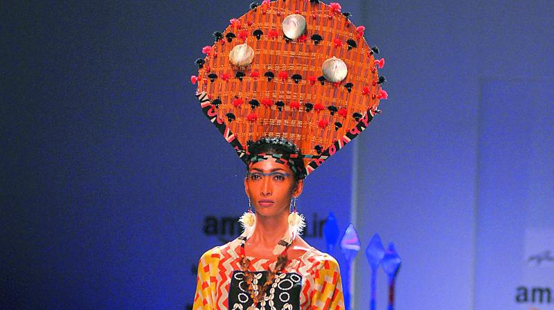 A model displays an outfit by designer Anupama Dayal who worked with four Naga tribes for her collection.