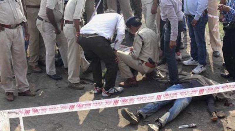 Police inspect the site of the encounter. (Photo: PTI)