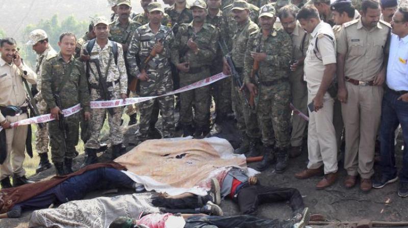 Police inspect the encounter site at the hillocks of Acharpura village after the STF killed eight Simi activists who escaped Central Jail in Bhopal on Monday. (Photo: PTI)