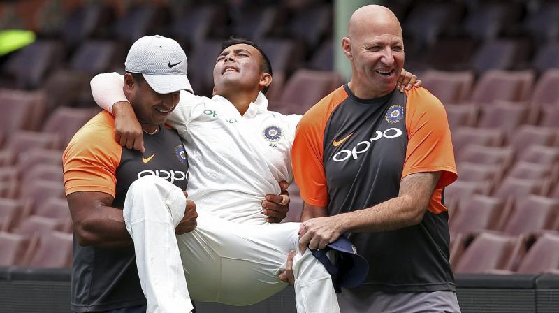 Prithvi Shaw was ruled out of the opening Test after hurting his left ankle while trying to take a catch at the deep mid-wicket boundary during Indias practice match against Cricket Australia XI at the Sydney Cricket Ground last week. (Photo: AP)