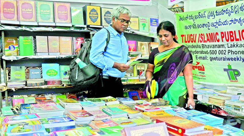 Book lovers at the stall set up by Telugu/Islamic publications at the book fair in Vijayawada. (Photo: DC)