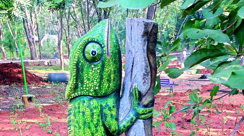 Chameleon, sculptured on a monolith, is another attraction at Divya Ramam in Tirupati. (Photo: DC)