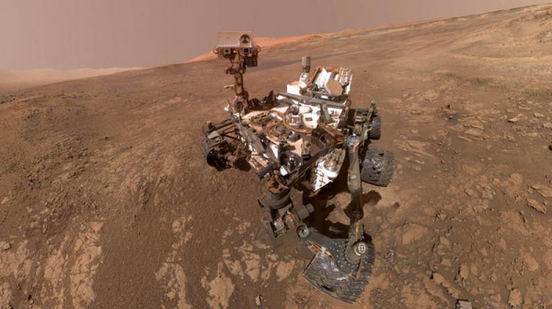 This composite image made from a series of Jan. 23, 2018 photos shows a self-portrait of NASAs Curiosity Mars rover on Vera Rubin Ridge. The rovers arm which held the camera was positioned out of each of the dozens of shots which make up the mosaic. (NASA/JPL-Caltech/MSSS via AP)