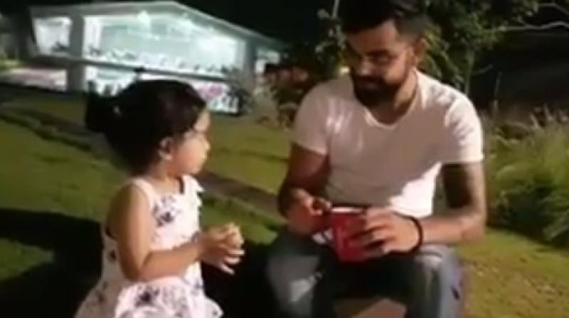 Virat Kohli, who enjoys spending times with the kids, wrote, My reunion with Ziva. What a blessing it is to be around pure innocence. (Photo: Screengrab)