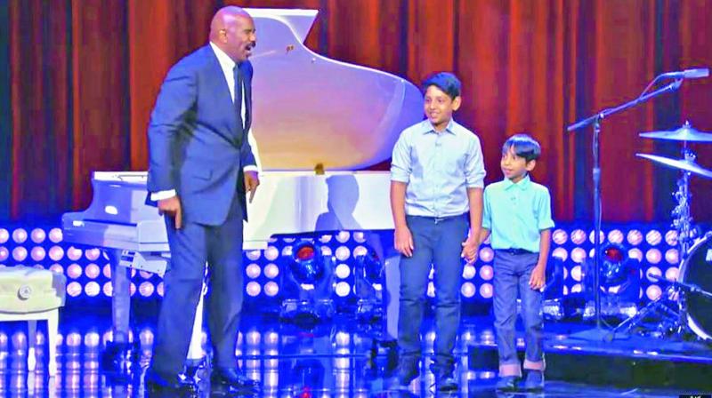 Big on talent: (From left to right) Host Steve Harvey with  12-year-old Jacob and 9-year-old Jonathan