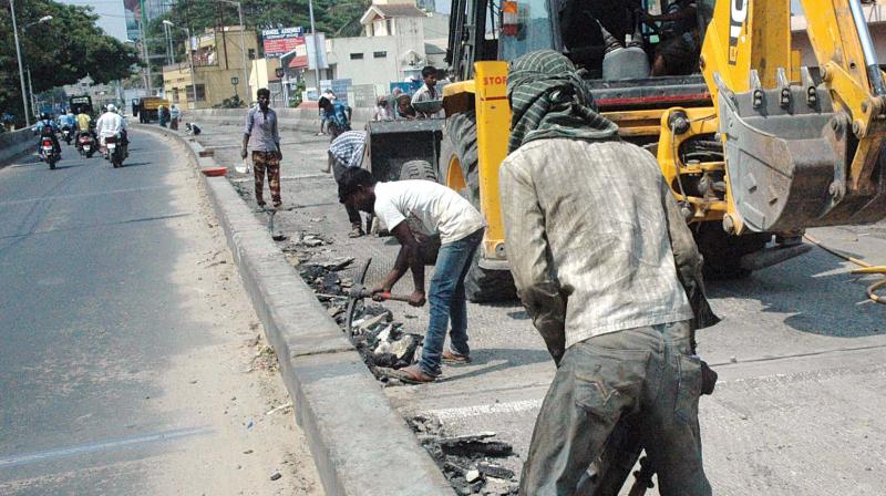 Road resurfacing work in progress at Lingarajapuram flyover  in Bengaluru . (Photo:DC)