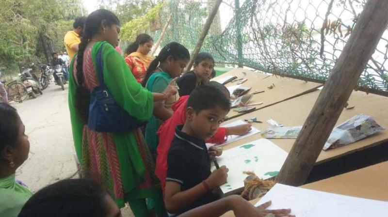 School kids paint at the day-long Lake Festival. (Photo: DC)