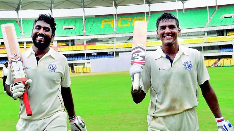 Tripura batsmen Smit Patel (left, 104) and Udiyan Bose (152) walk back to the pavilion at the end of the third days play against Services at Barshapara stadium in Guwahati on Saturday. (Photo: AP)