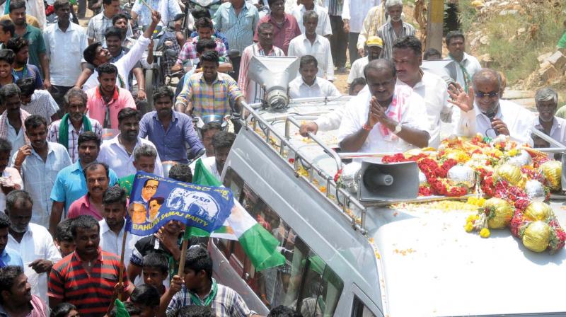 State JD(S) chief H.D. Kumaraswamy campaigns for party candidate G.T. Devegowda in Chamundeshwari on Sunday