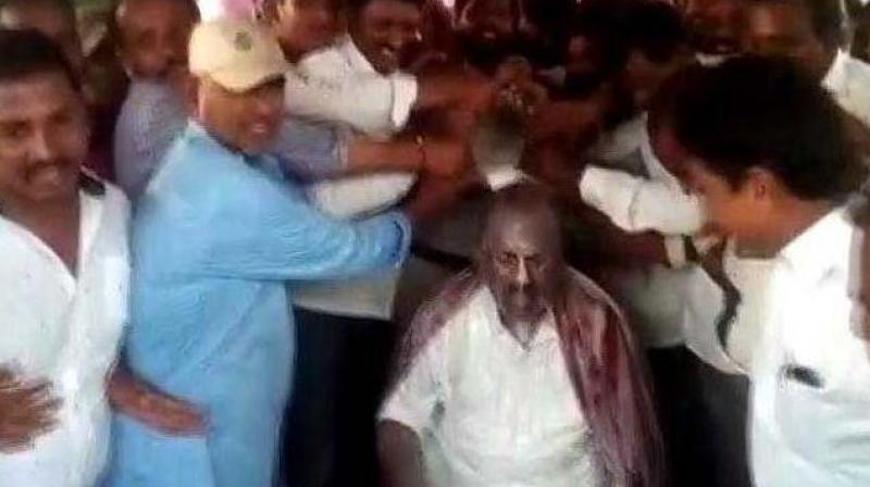 Telangana Assembly Speaker Sirikonda Madhusudhana Chary gets a VVIP milk bath from his supporters. (ANI | Screengrab)