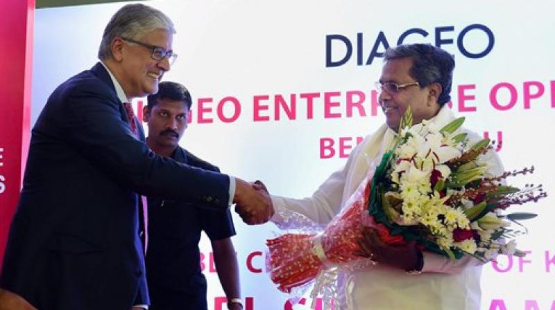 Karnataka Chief Minister Siddaramaiah with Ivan Menzes, Chief Executive,Diageo during the inauguration of the Diageo Enterprise Operations in Bengaluru. (Photo:PTI)