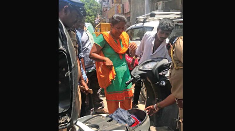 Kavitha whose money was stolen from her vehicle in Royapuram on Thursday (Photo: DC)