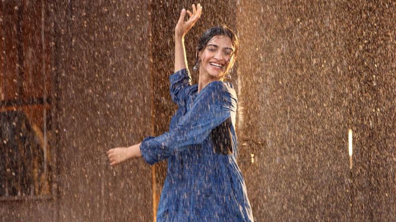 Sonam Kapoor shares a photo of her dancing in the rains.