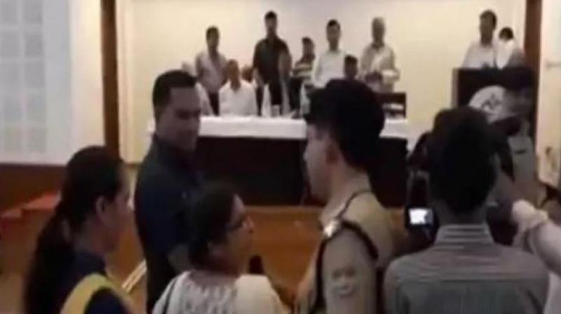 In video, Uttarakhand CM is seen losing his temper and directing the police to suspend the teacher, after she allegedly used abusive language and showed indecency, while seeking transfer from a remote location. (Photo: Screengrab | ANI)