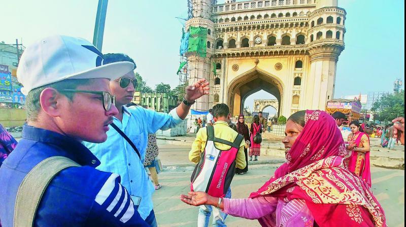 A woman begs from tourists near Charminar in Old City on Tuesday. (Photo: DC)