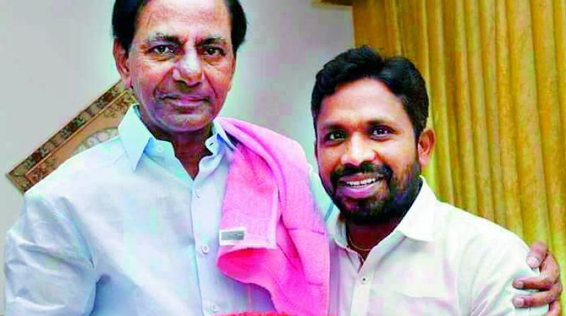 Chief Minister K. Chandrasekhar Rao with Errolla Srinivas, who was appointed to head the SC, ST commission. (Photo: DC)