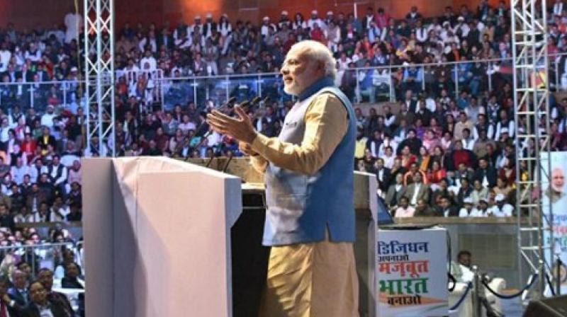 Prime Minister Narendra Modi addressing the gathering at the DigiDhan Mela in New Delhi on Friday. (Photo: PTI)