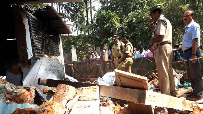 Police team examines the temple premises at Vattamkulam near Edappal