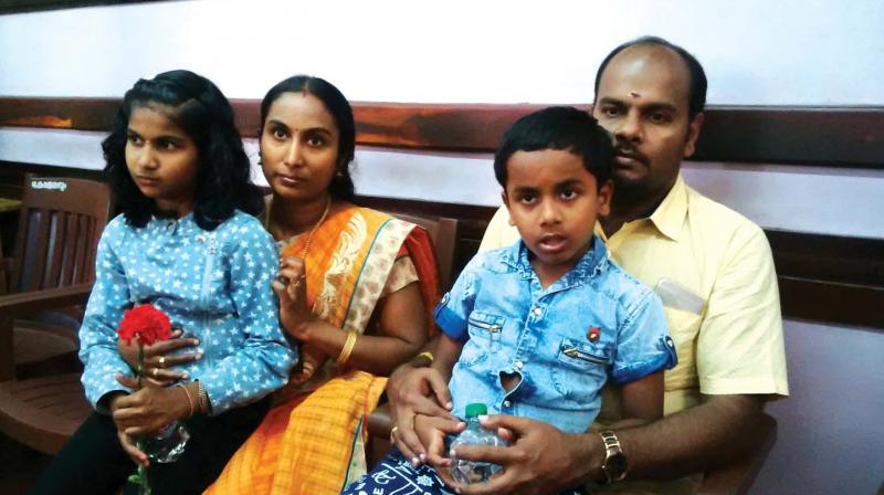 Nayan and his sister Sivapriya with their parents Syam and Priyanka.