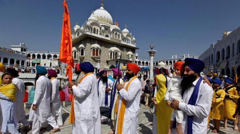 Sikh pilgrims march during the Baisakhi festival, at the shrine of Gurdwara Punja Sahib in Hasan Abdal, some 50 kilometers from Islamabad, Pakistan, April 14, 2018.(Photo: AP)