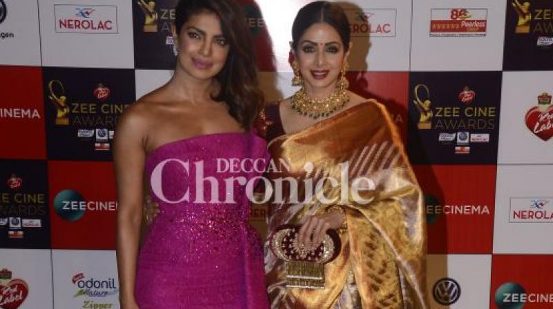Priyanka Chopra and Sridevi pose at an awards show.