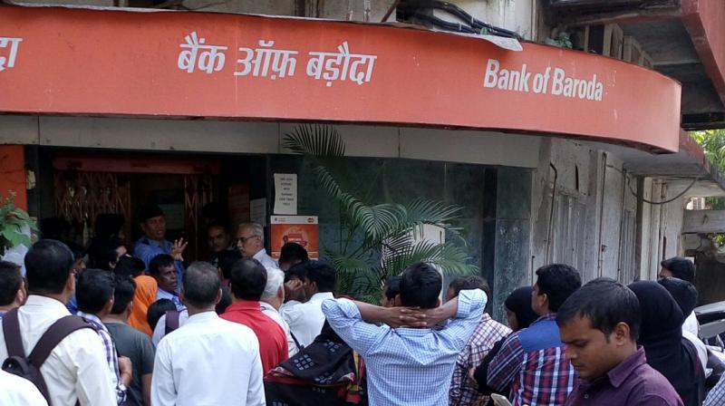 People queue up outside a Bank of Baroda branch in Wadala to deposit Rs 500 and Rs 1,000 notes.