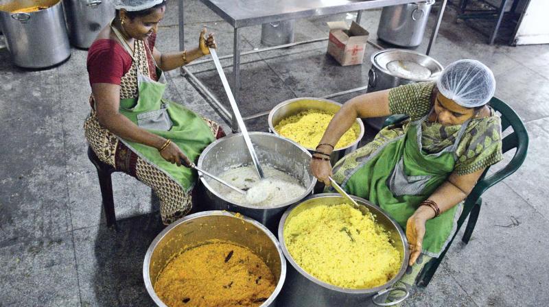 Workers with the prepared food at Amma canteen in Rajiv Gandhi government general hospital. (Photo: DC)